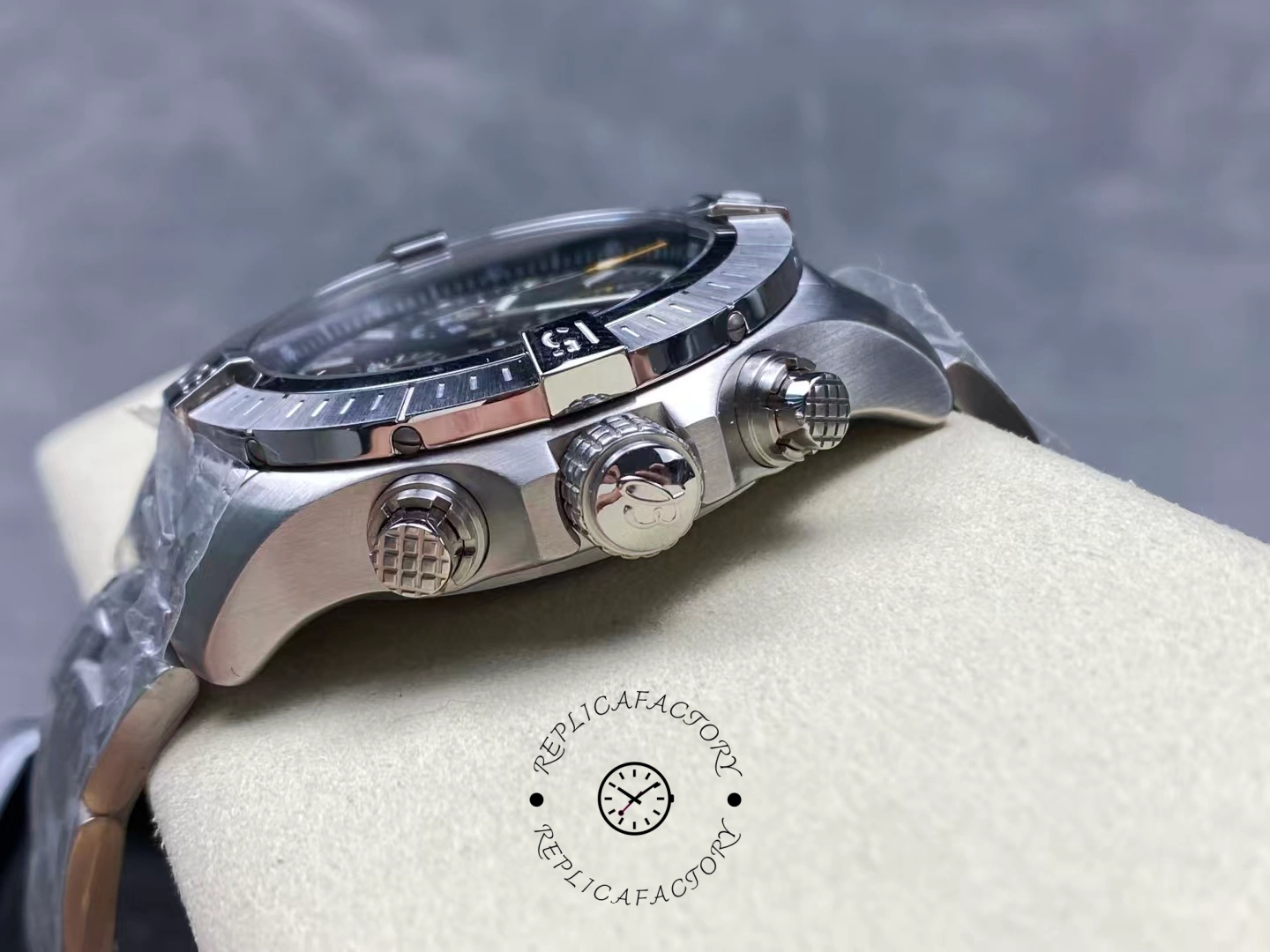 Side view of Breitling Avenger Chronograph 45 A13317101B1A1 showing crown and pushers.