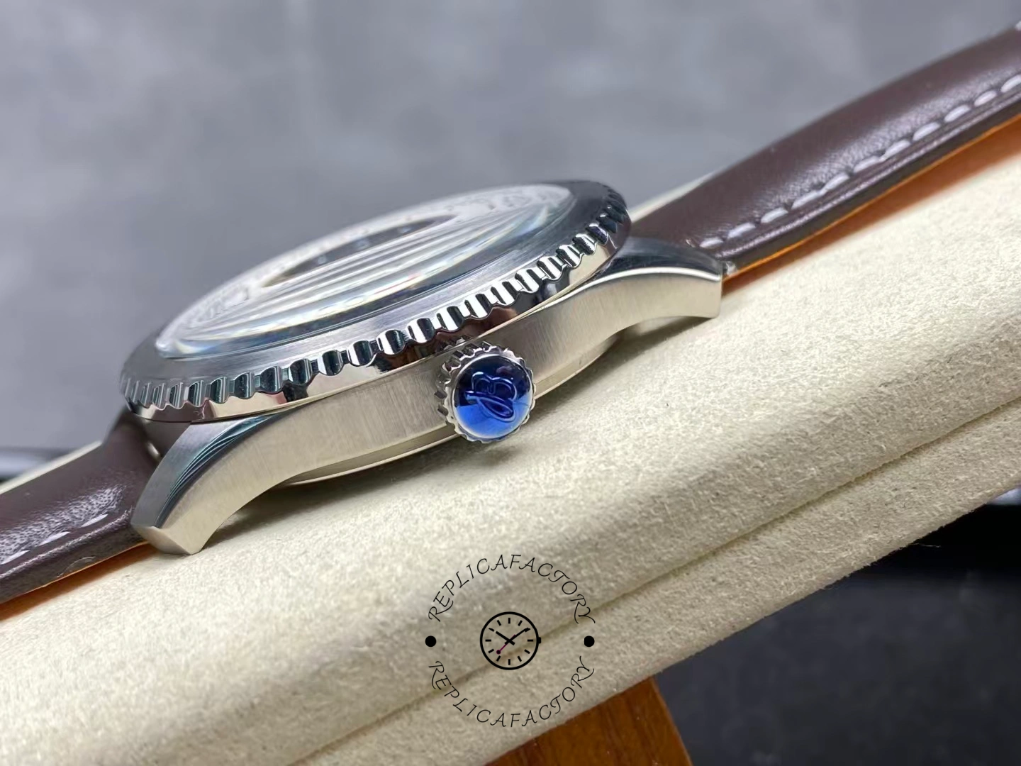 Side view of Breitling Aviator 8 B35 Automatic 43 AB3521U01G1P1 showing blue crown seal.