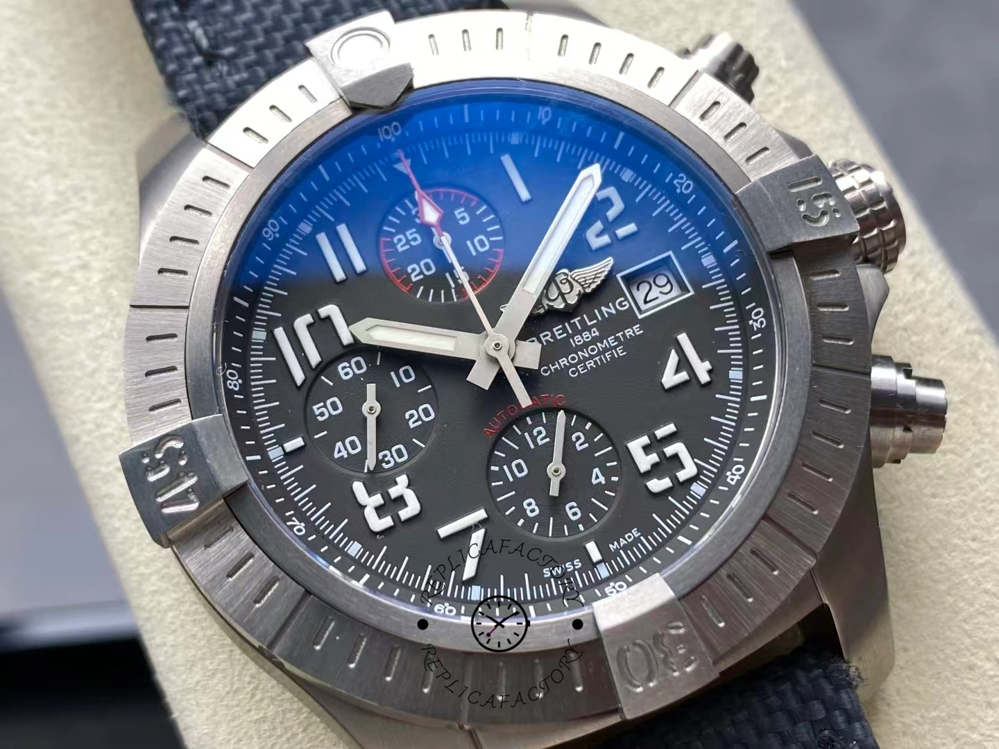 Macro shot of Breitling Avenger Bandit E13383101M1W1 dial showing subdials and red accents.