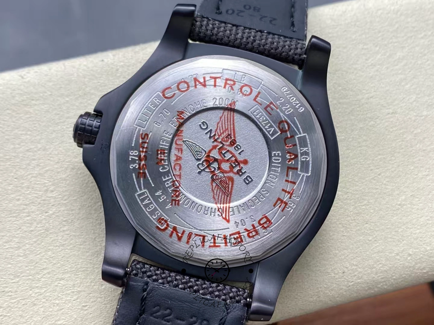 Caseback of Breitling Avenger Blackbird 44 V17311101B1W1 engraved with red quality control marks.