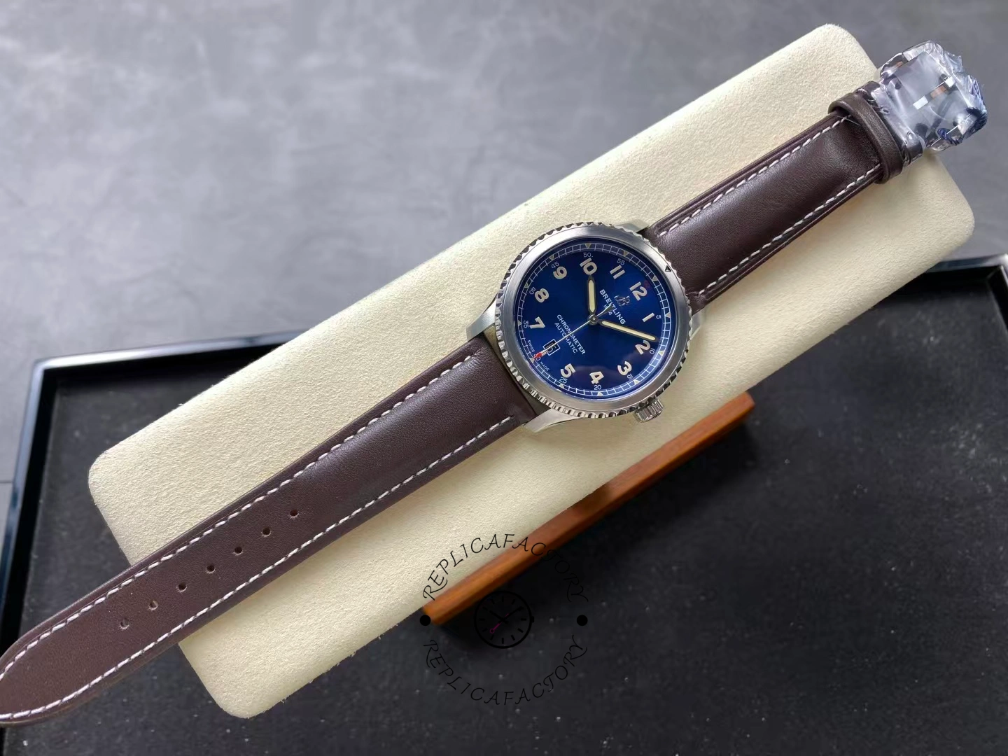 Full top-down view of Breitling Aviator 8 Automatic 41 A17315101C1X1 on display cushion.