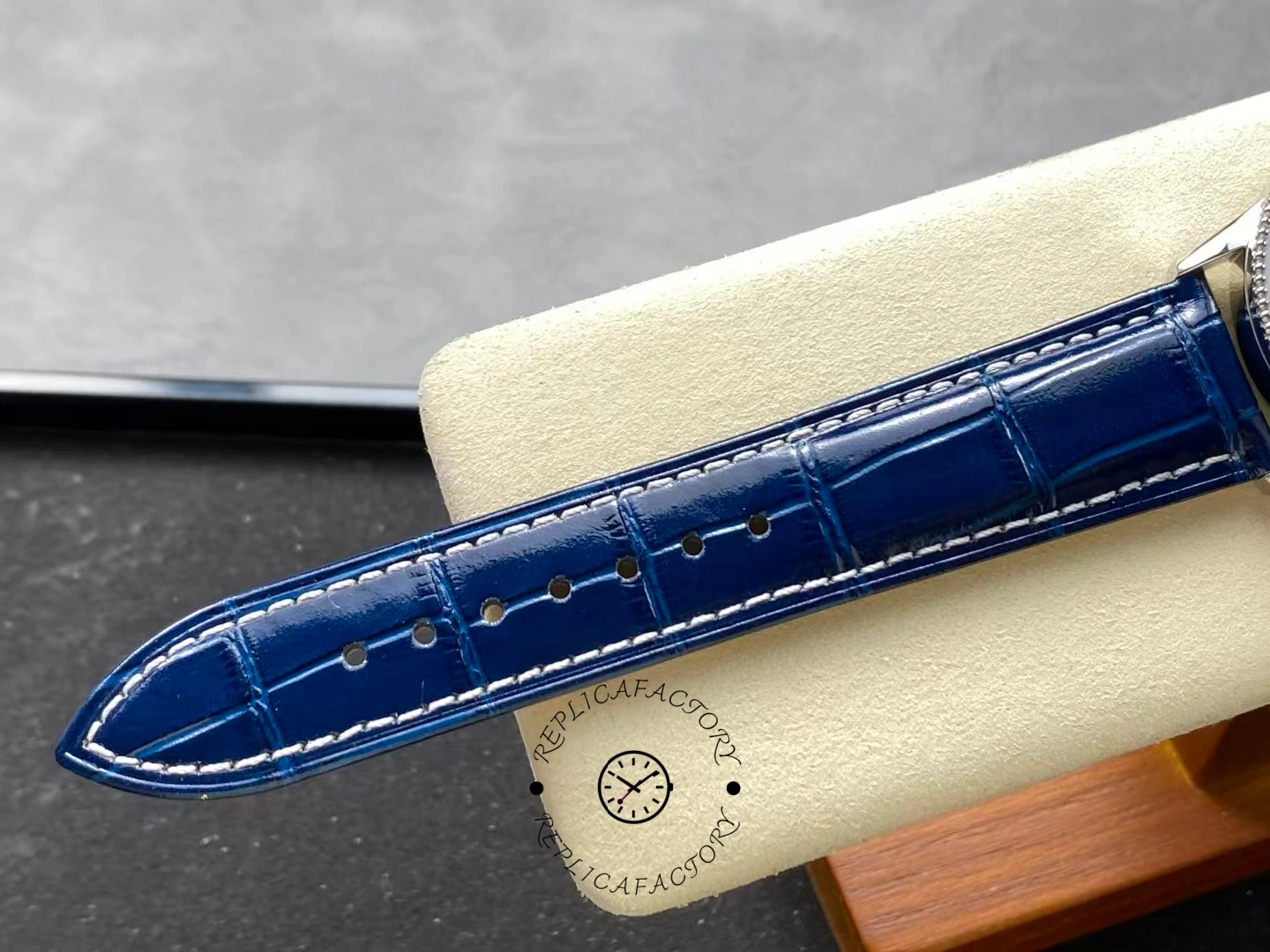 Close-up of Breitling Navitimer 38 A17325211C1P1 blue alligator strap stitching.