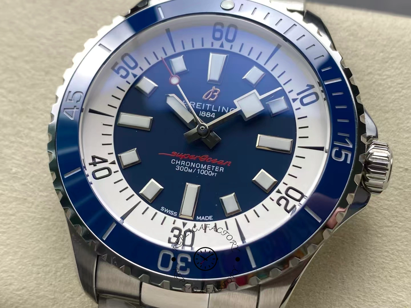 Close-up of Breitling Superocean 42 A17375E71C1A1 blue dial with white outer ring.
