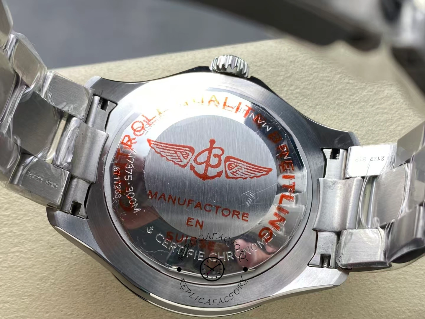 Caseback of Breitling Superocean 44 A17376211C1A1 with red winged logo engraving.