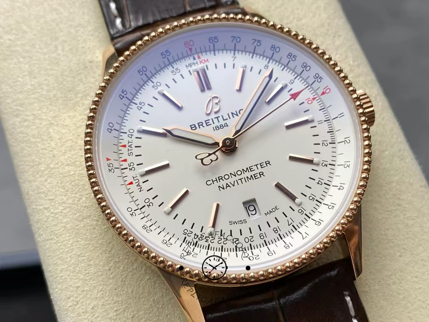 Macro view of Breitling Navitimer 41 R17326211G1P1 showing dial markers and logo.