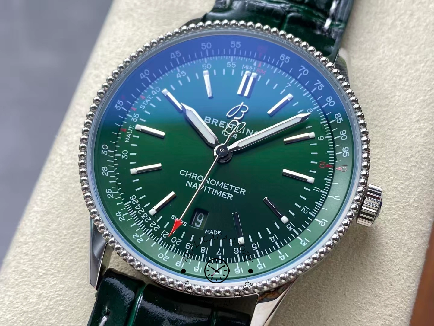 Close-up of Breitling Navitimer 41 A17326361L1P1 green dial with luminous hands.