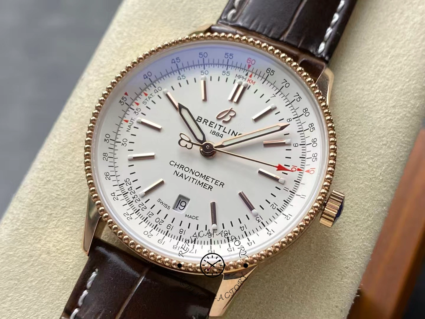 Close-up of Breitling Navitimer 41 R17326211G1P1 rose gold case and white dial.