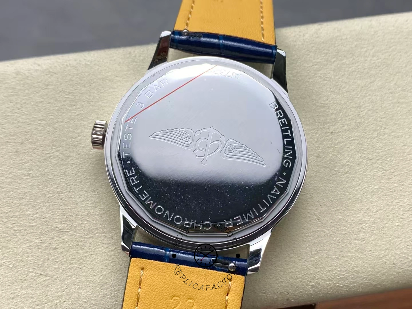 Caseback of Breitling Navitimer 38 A17325211C1P1 showing engraved wings logo.