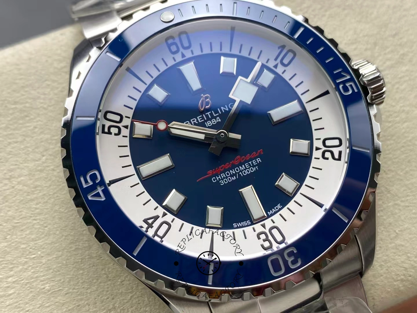 Macro of Breitling Superocean 42 A17375E71C1A1 showing polished blue bezel and markers.