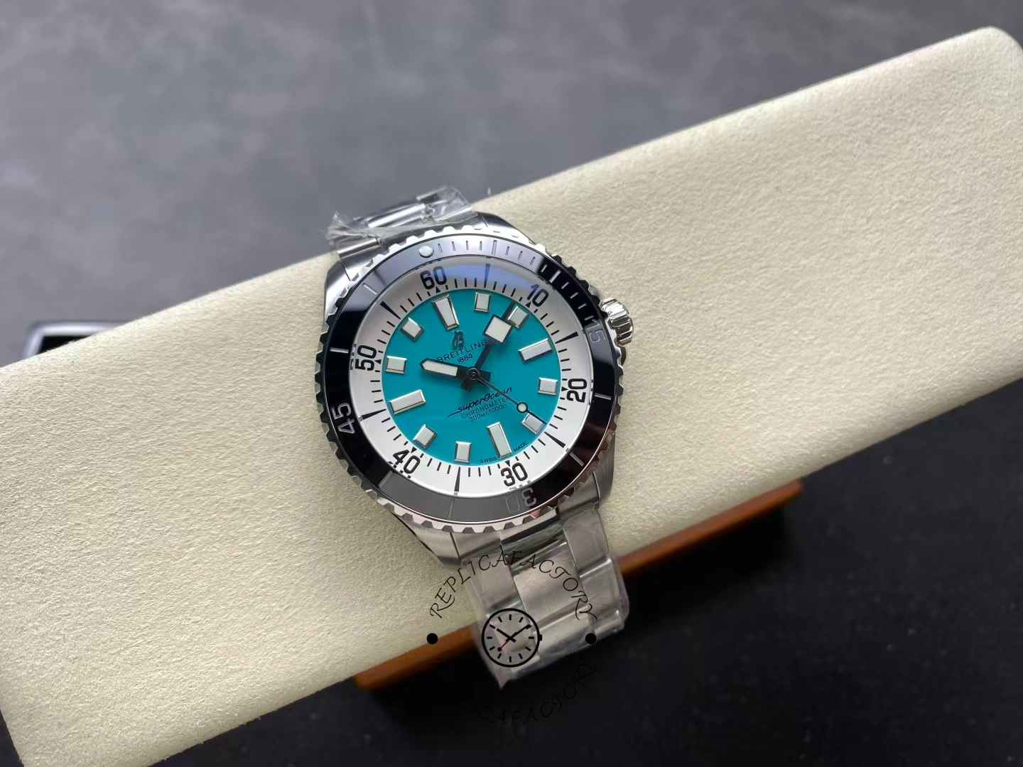 Angled top view of Breitling Superocean 44 A17376211L2A1 turquoise dial diver watch.
