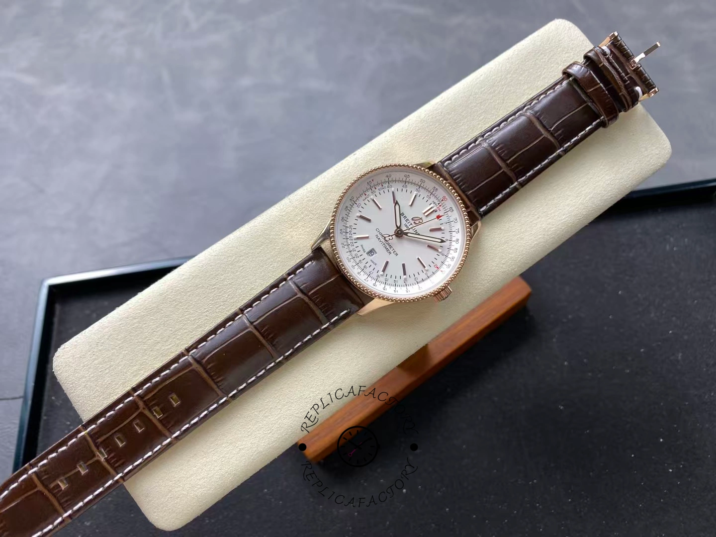 Full view of Breitling Navitimer 41 R17326211G1P1 with white dial and brown leather strap.