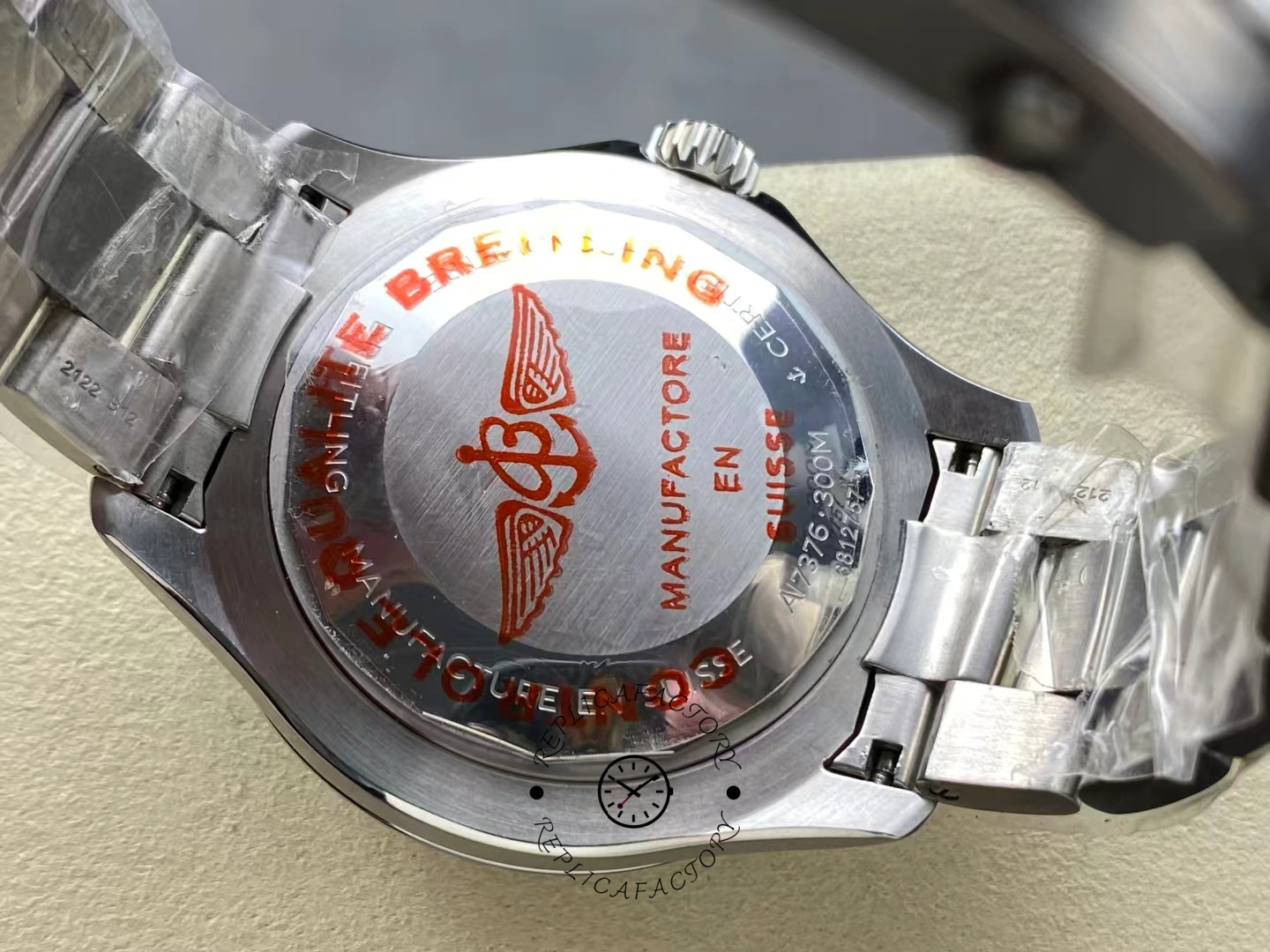 Caseback of Breitling Superocean 44 A17376211L2A1 with red logo engraving.