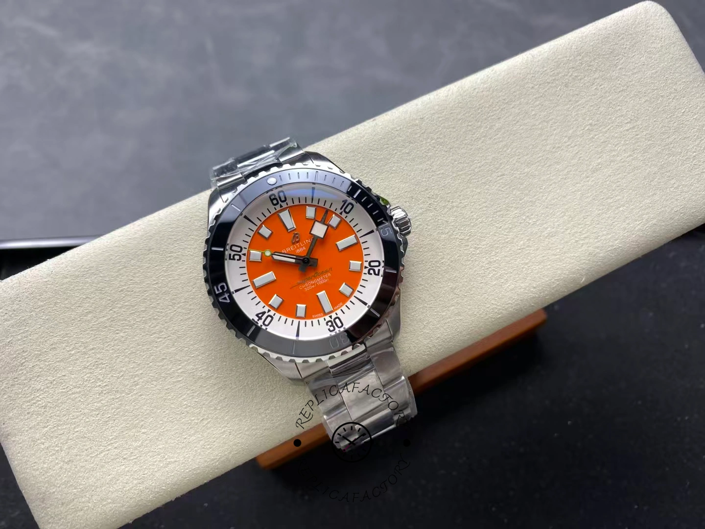 Full top view of Breitling Superocean 42 A173751A1O1S1 orange dial and black bezel.