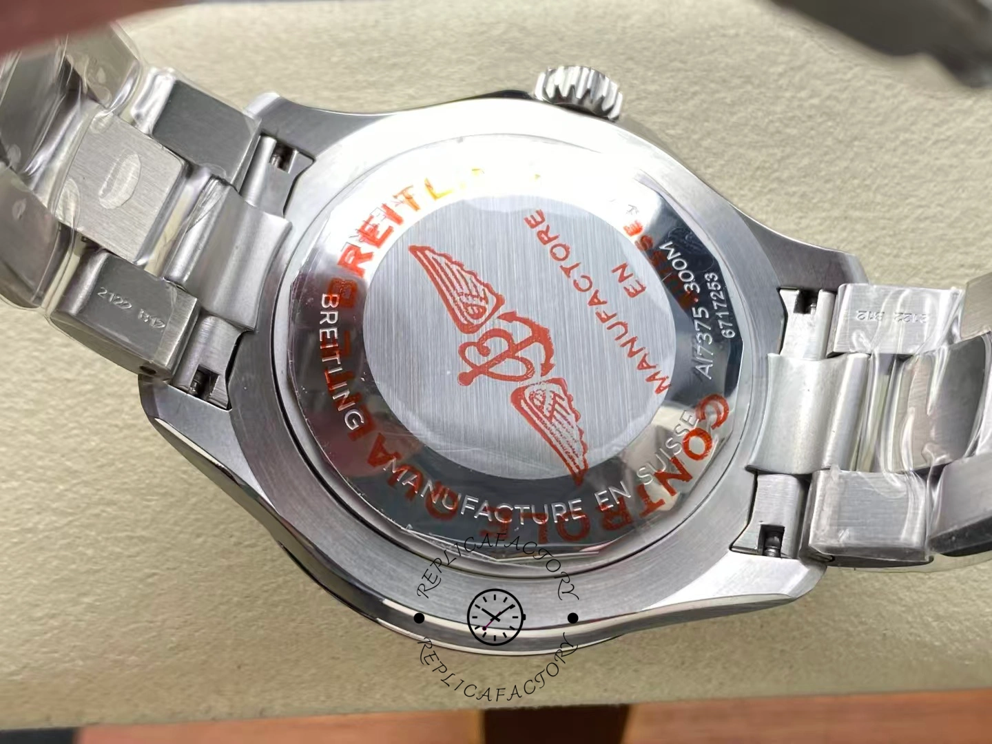 Caseback of Breitling Superocean 42 A17375E71G1A1 with red logo engraving.