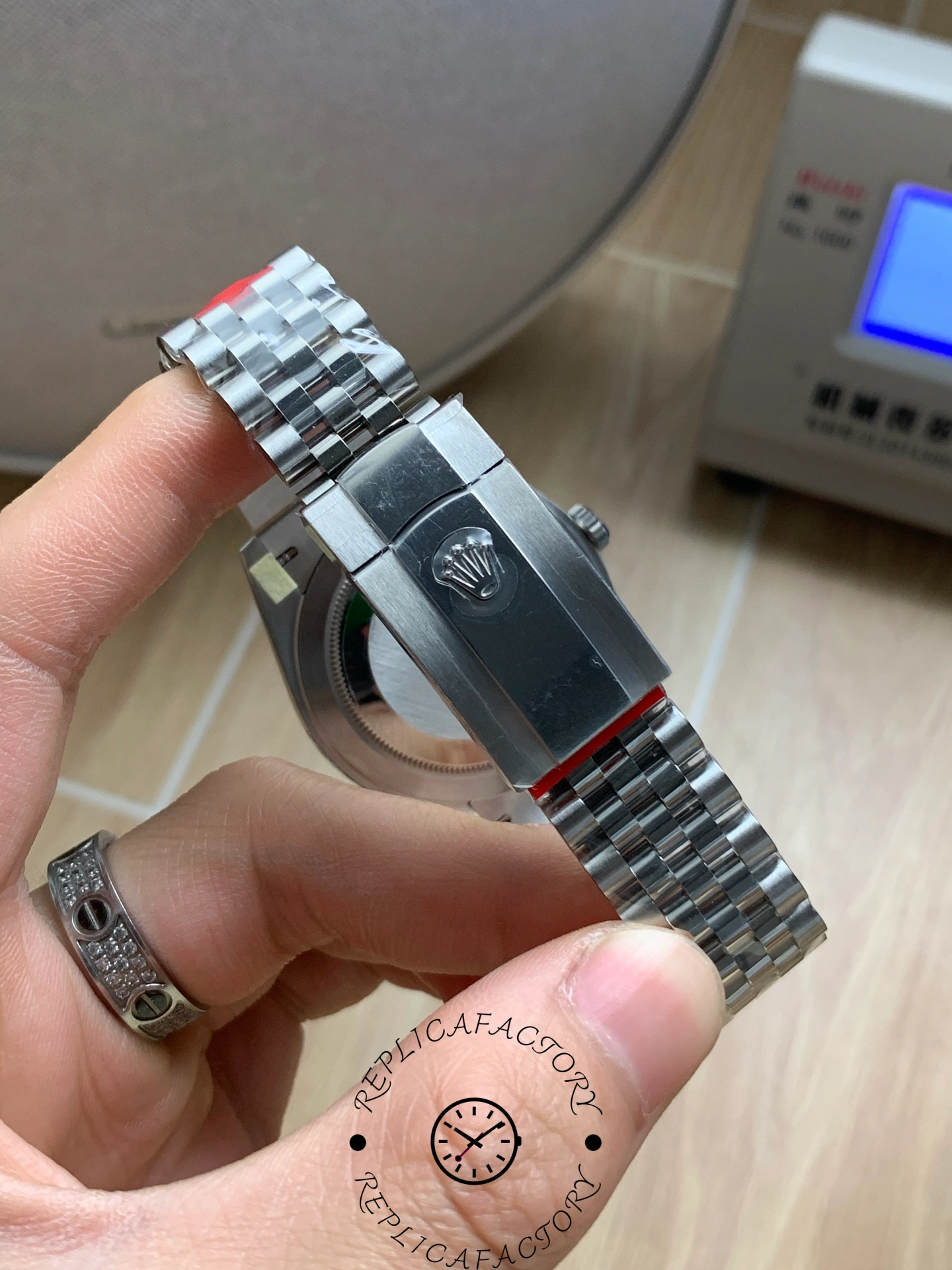 Rolex Datejust 126334 clasp exterior with engraved crown logo.