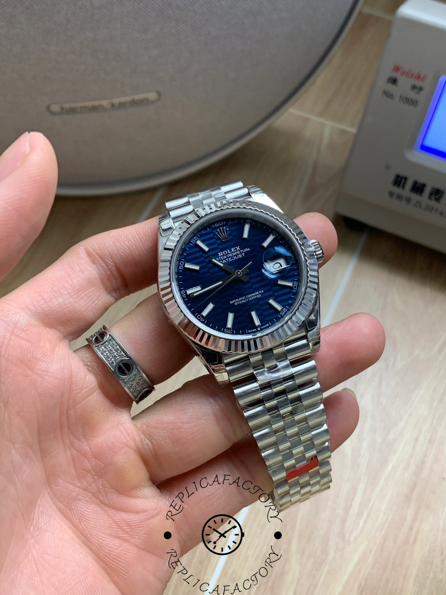 Angled hand-held view of Rolex Datejust 126334 blue textured dial.