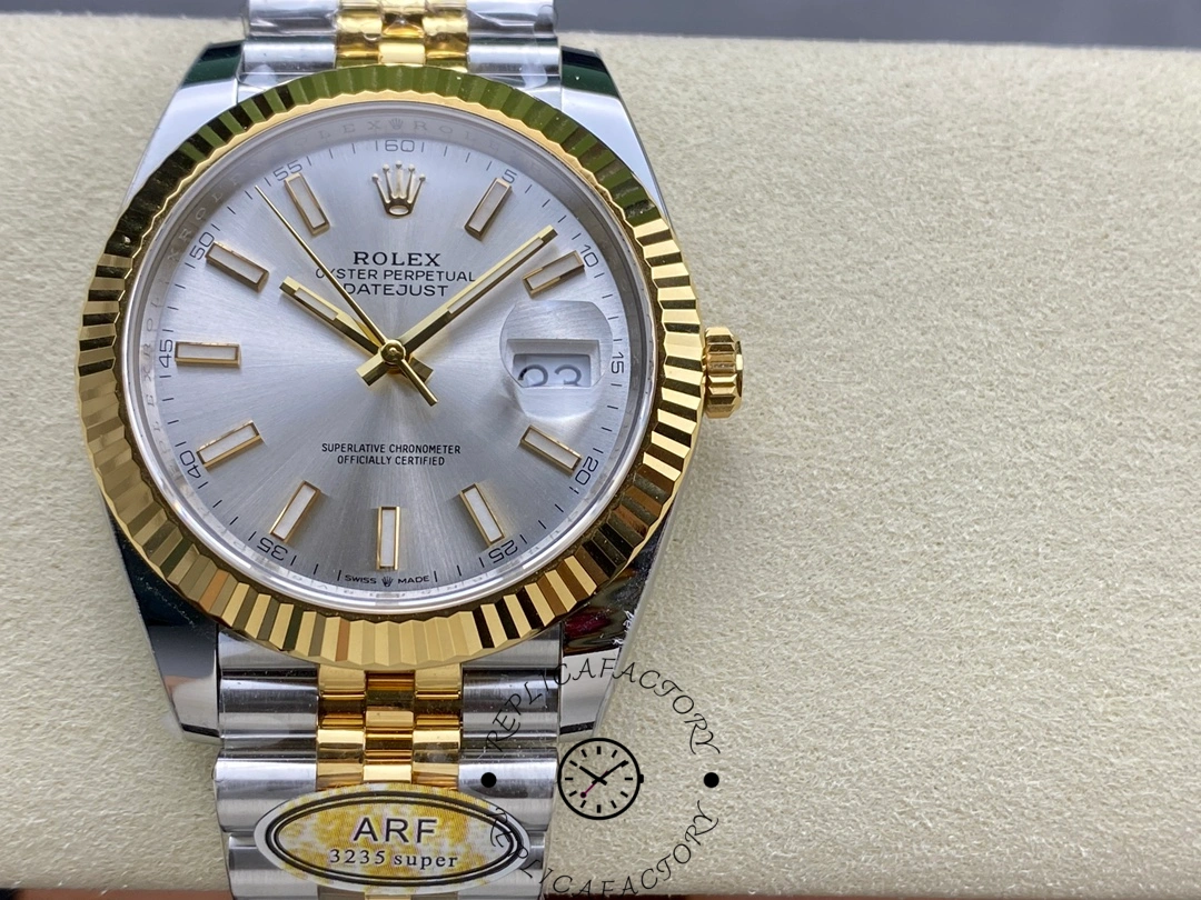 Close-up of the Rolex Datejust 41 M126333-0002 showing silver dial and gold fluted bezel.