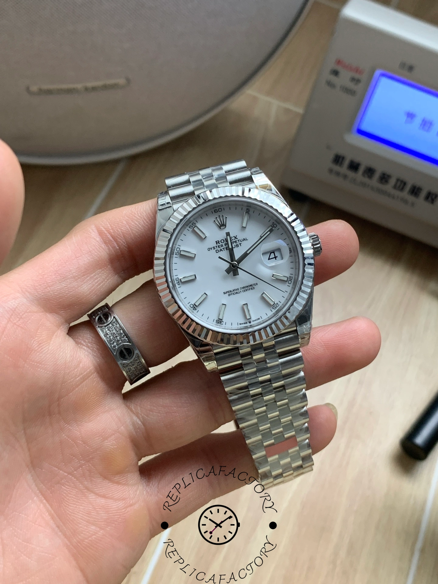 Close handheld shot of the Rolex Datejust 41 M126334-0010 showing the dial and date window.