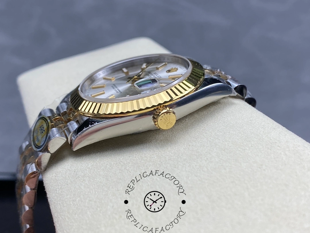 Side crown view of the Rolex Datejust 41 M126333-0002 with gold crown and silver dial.