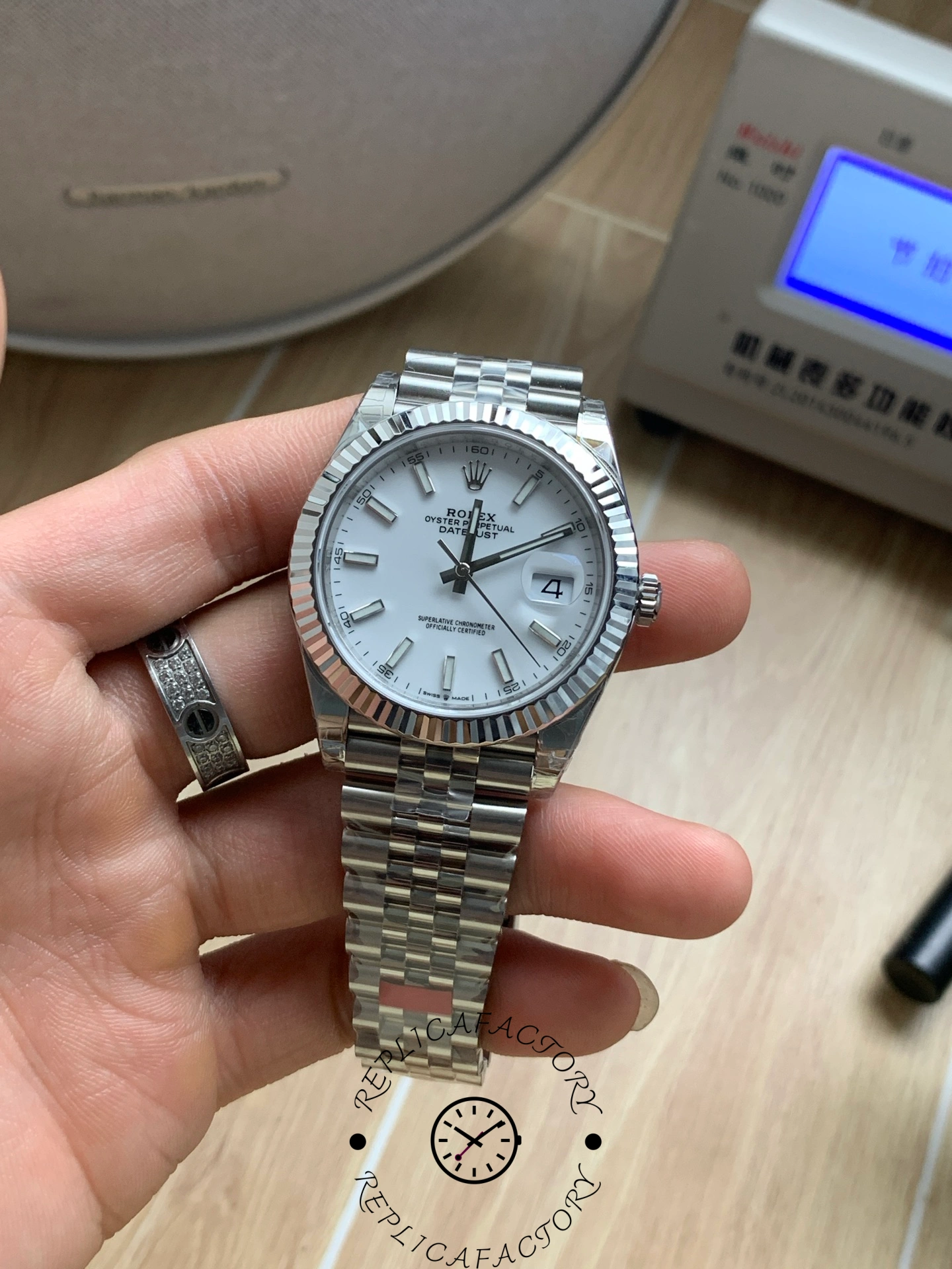 Slight angled handheld view of the Rolex Datejust 41 M126334-0010 showing dial and bezel.
