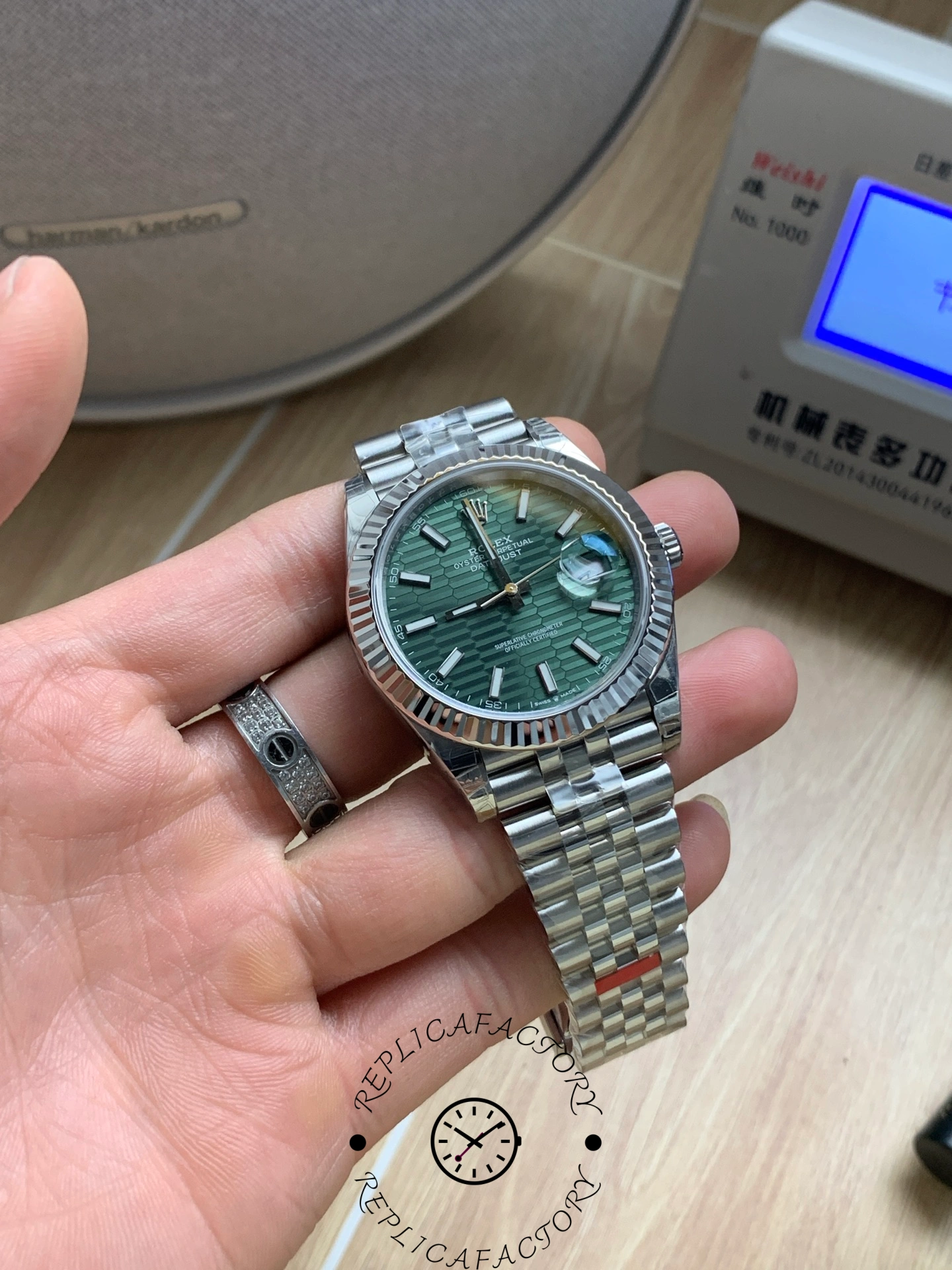 Detailed wrist-level shot of Rolex Datejust 41 126334-0030 mint green dial.