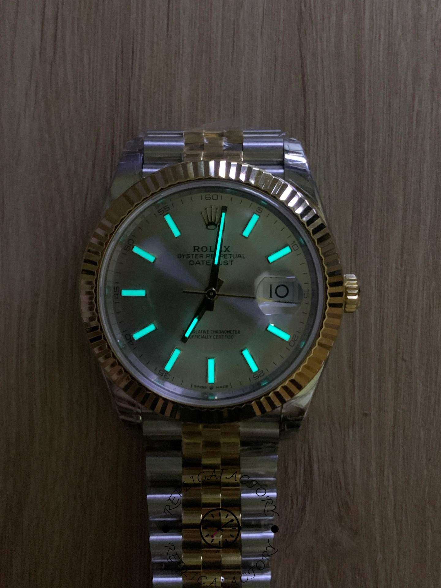 Lume view of the Rolex Datejust 41 M126333-0002 showing glowing hour markers.
