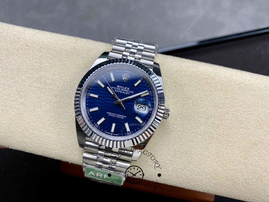 Full view of Rolex Datejust 126334 ARF on cushion with blue textured dial and Jubilee bracelet.