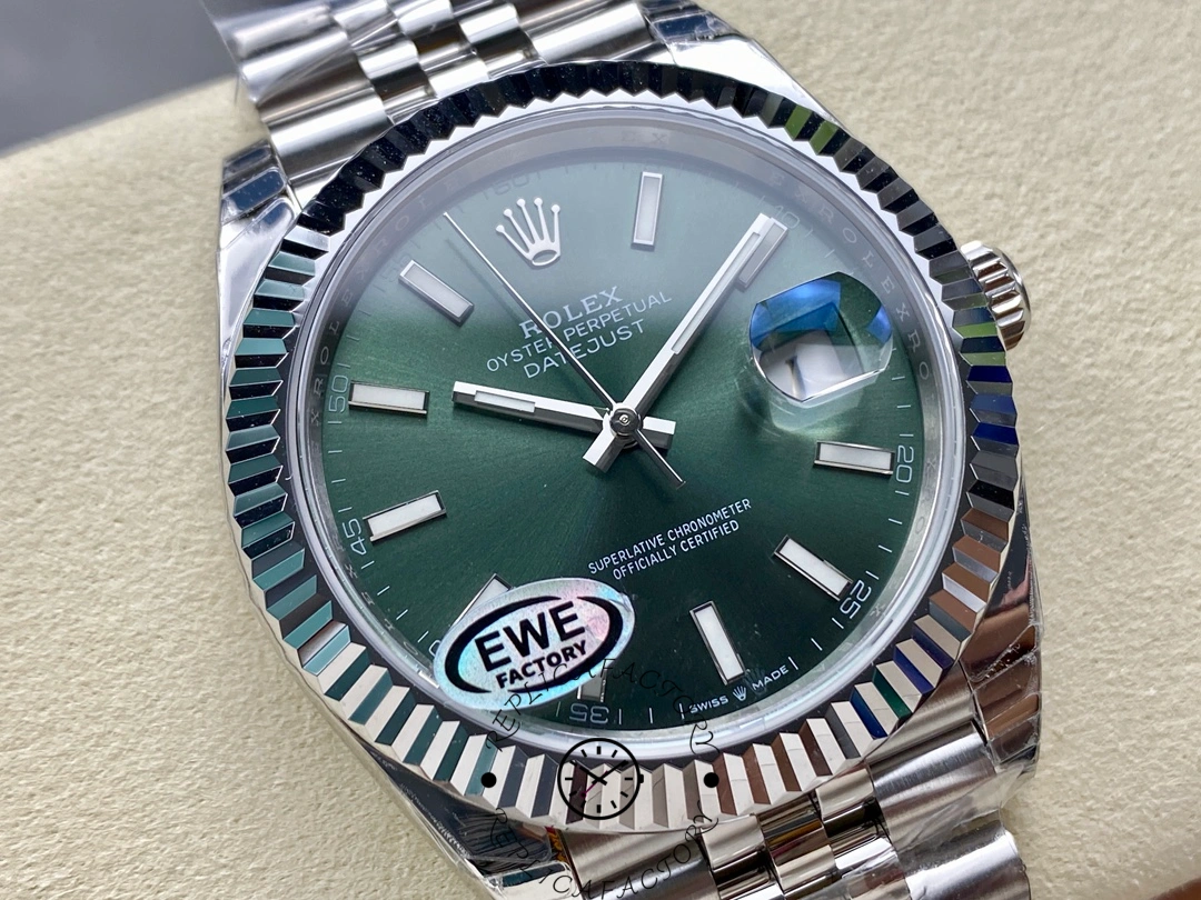 Angled close-up of Rolex Datejust 126334 EWE showing fluted bezel and green dial.