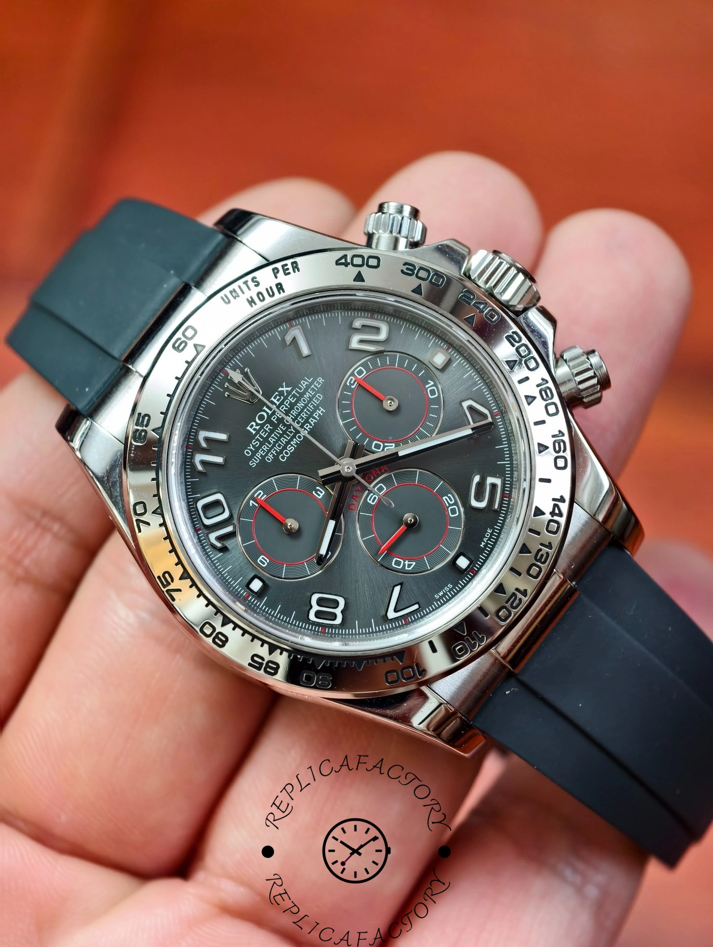 angled handheld view of the Rolex Daytona 116519 showing the detailed grey dial and polished steel case.