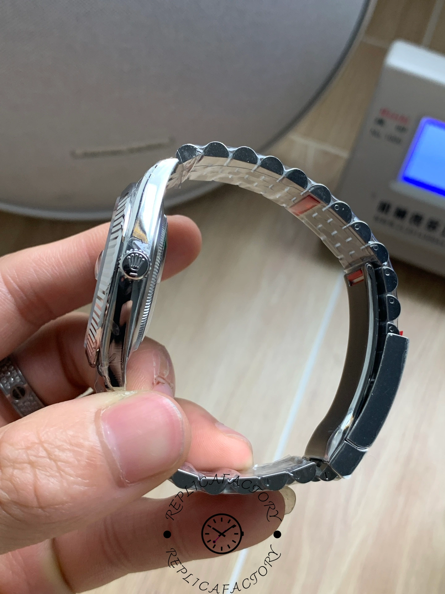 Side view of the Rolex Datejust 41 M126334-0010 showing the crown and polished case.