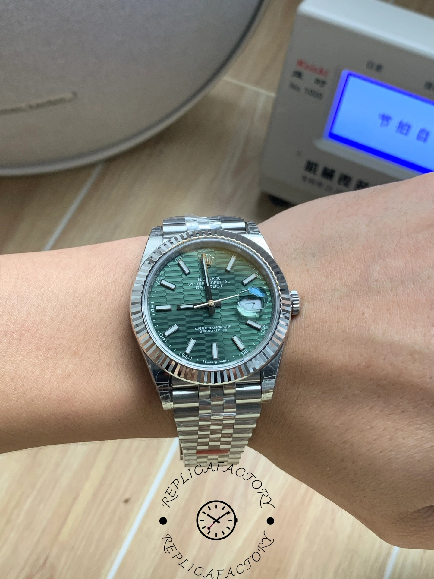 Wrist shot of Rolex Datejust 41 126334-0030 with mint green dial.