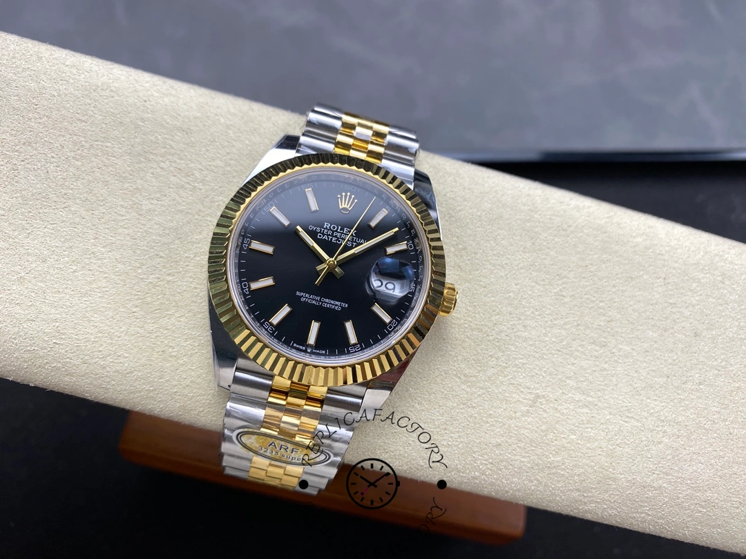 Full view of Rolex Datejust 41 126333 on display stand with black dial and two-tone bracelet.