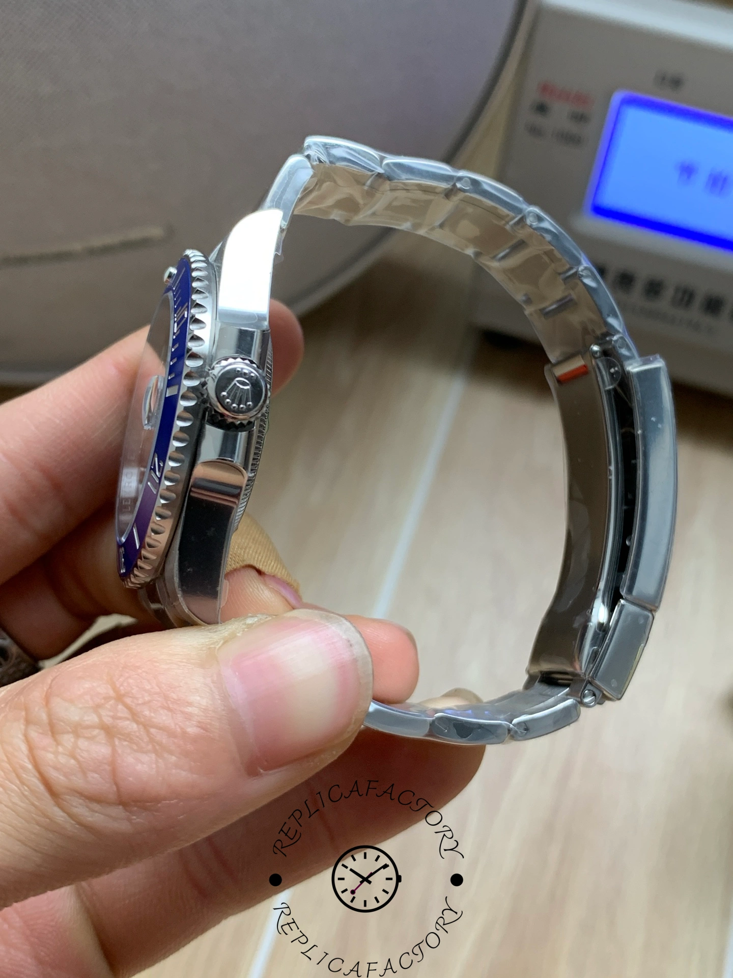 Side view of Rolex Submariner 126619LB showing crown and case profile.