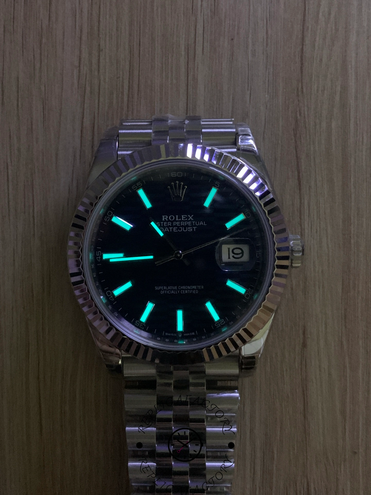 Lume shot of Rolex Datejust 126334 showing glowing hour markers.