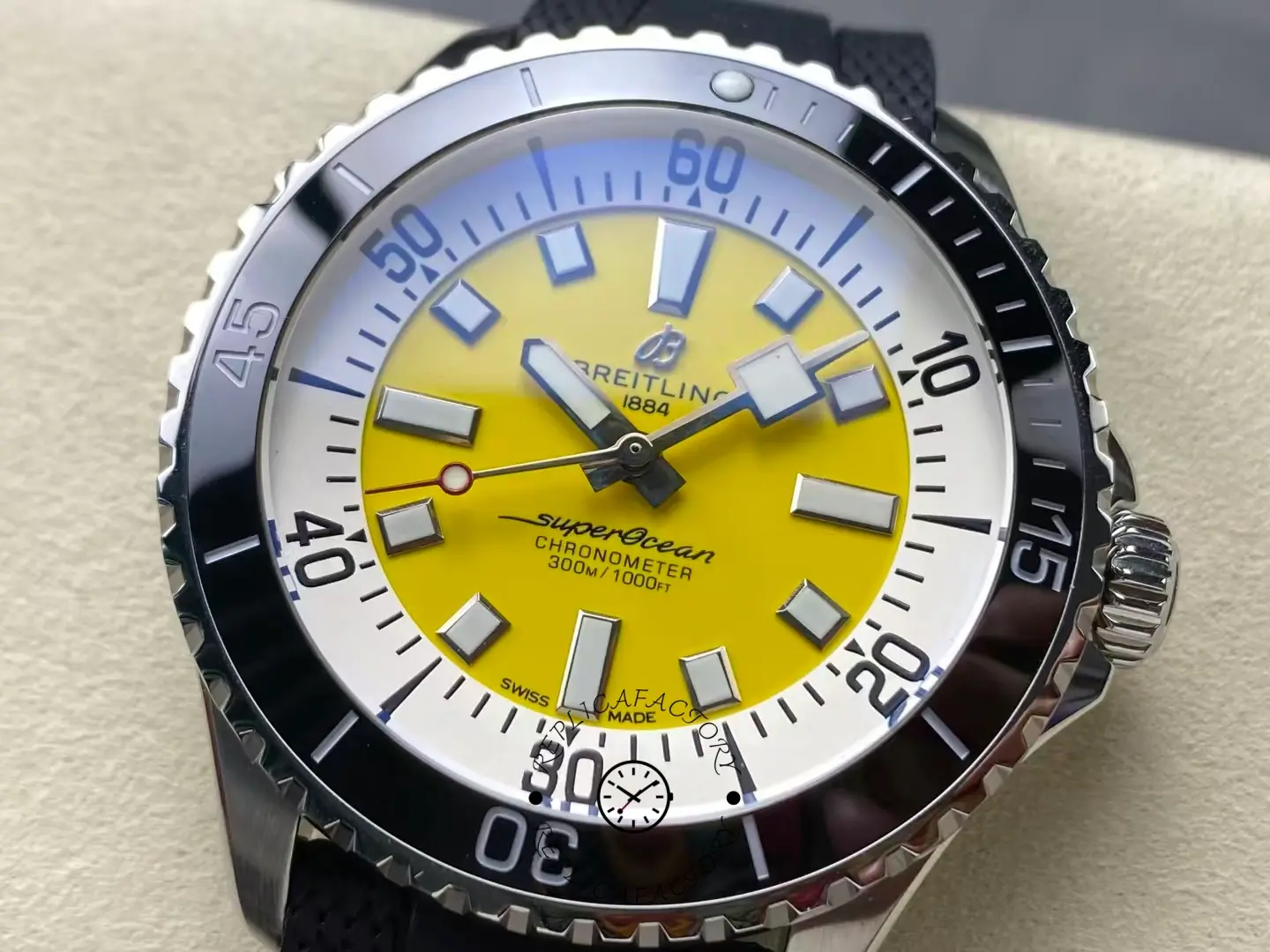 Close-up of Breitling Superocean A17375211I1S1 yellow dial and white outer ring.