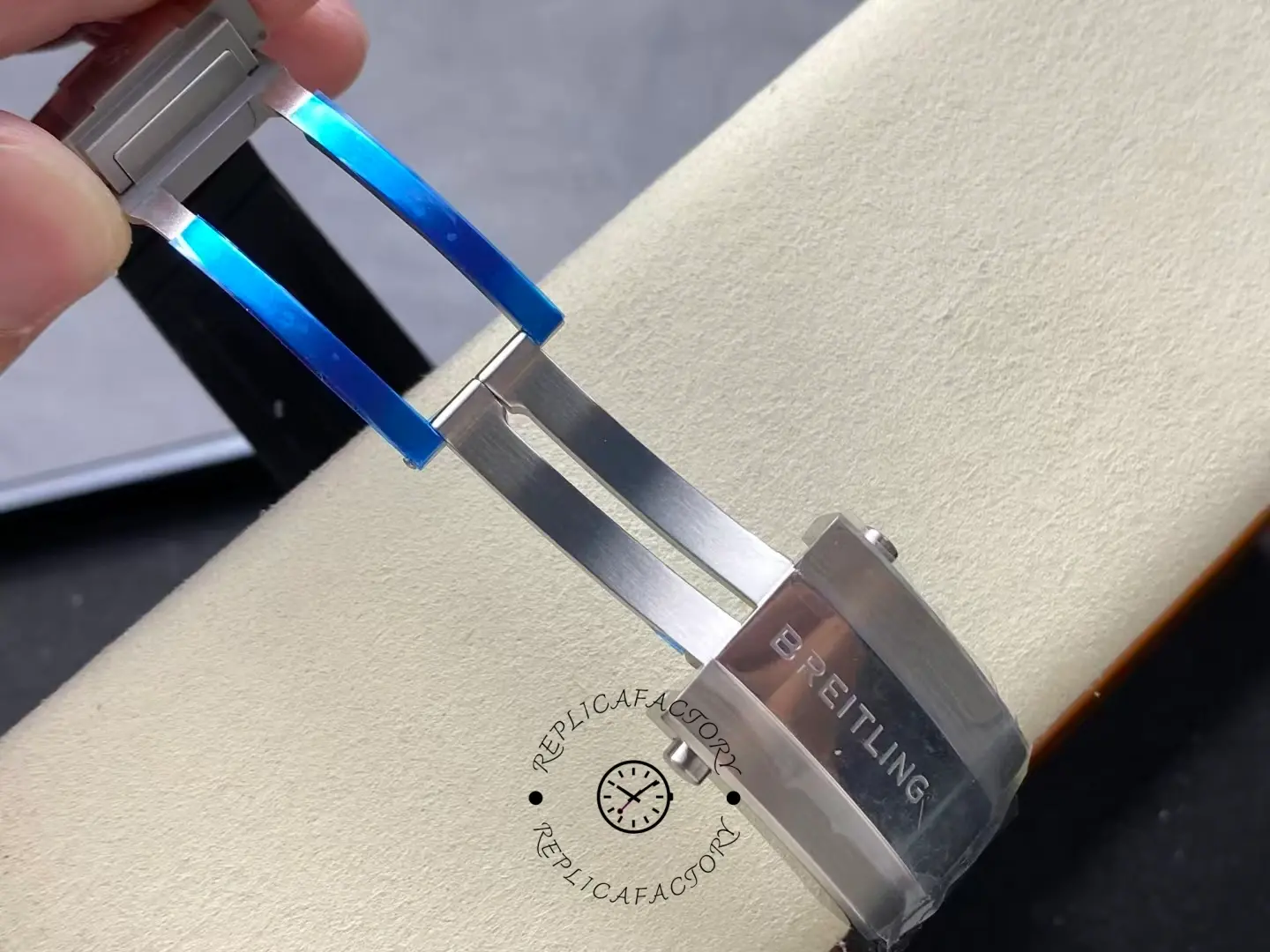 Folding clasp of Breitling Superocean A17375211I1S1 showing deployment buckle with blue film.