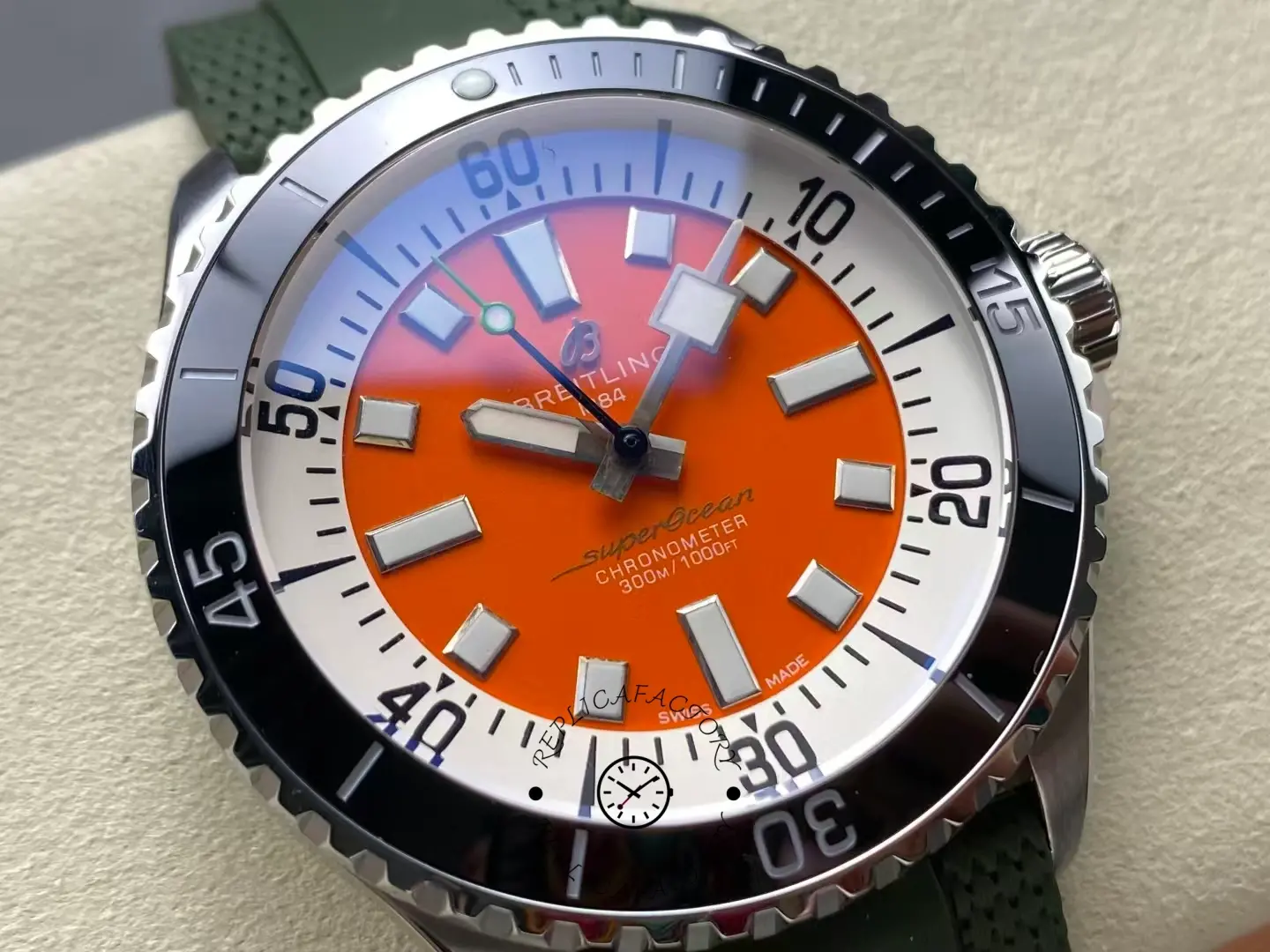 Macro shot of Breitling Superocean A173751A1O1S1 orange dial and black ceramic bezel.