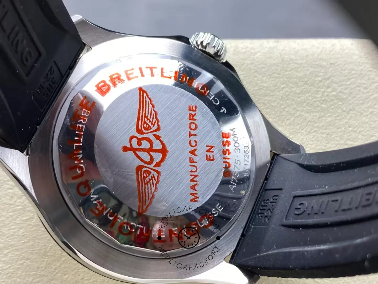 Caseback of Breitling Superocean A17375211I1S1 showing red winged B logo engraving.
