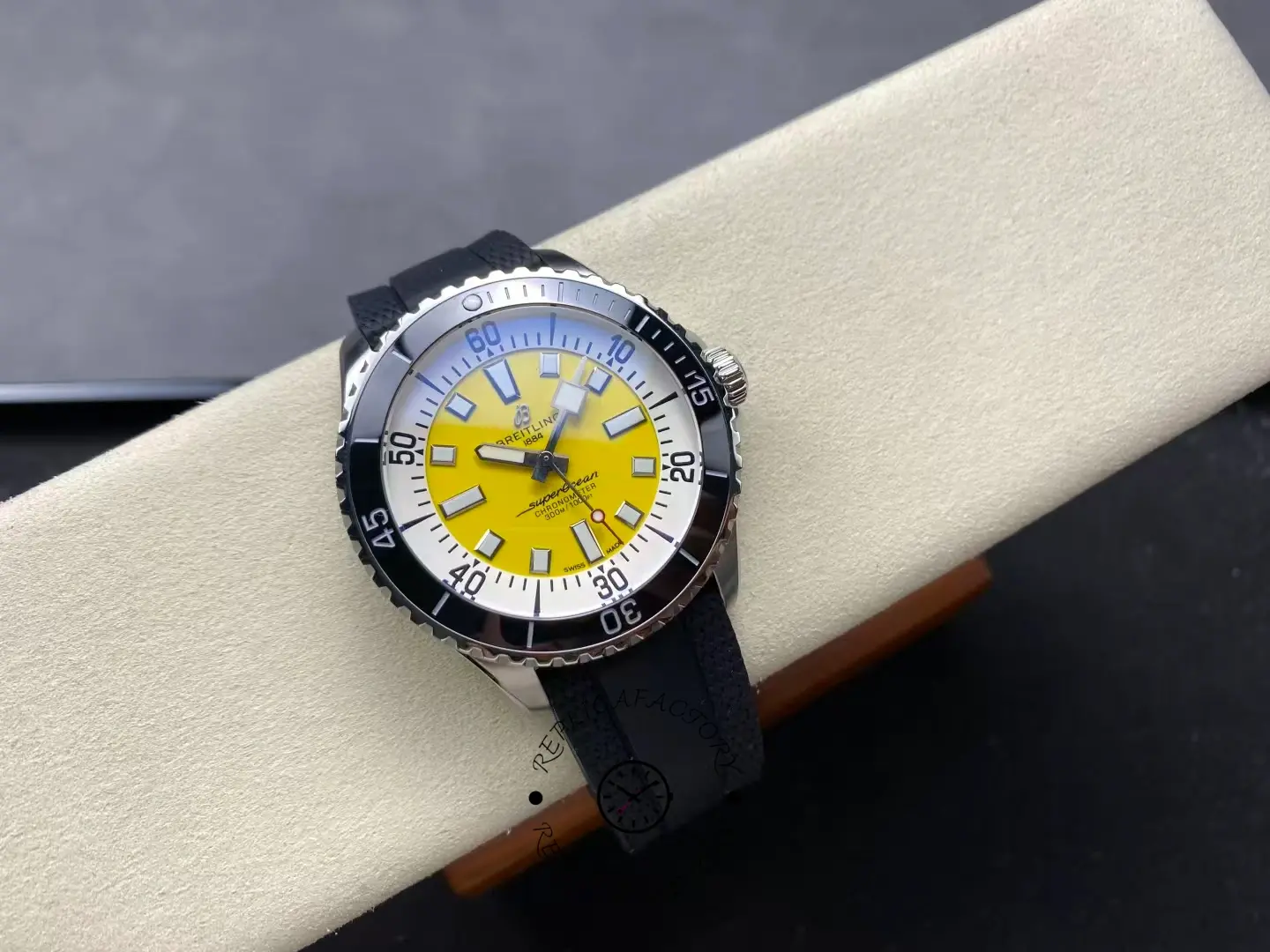 Angled top view of Breitling Superocean A17375211I1S1 yellow dial diving watch.