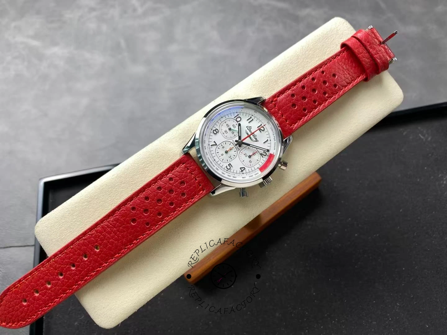 Full view of Breitling Top Time B01 AB01766A1A1X1 white dial red strap.
