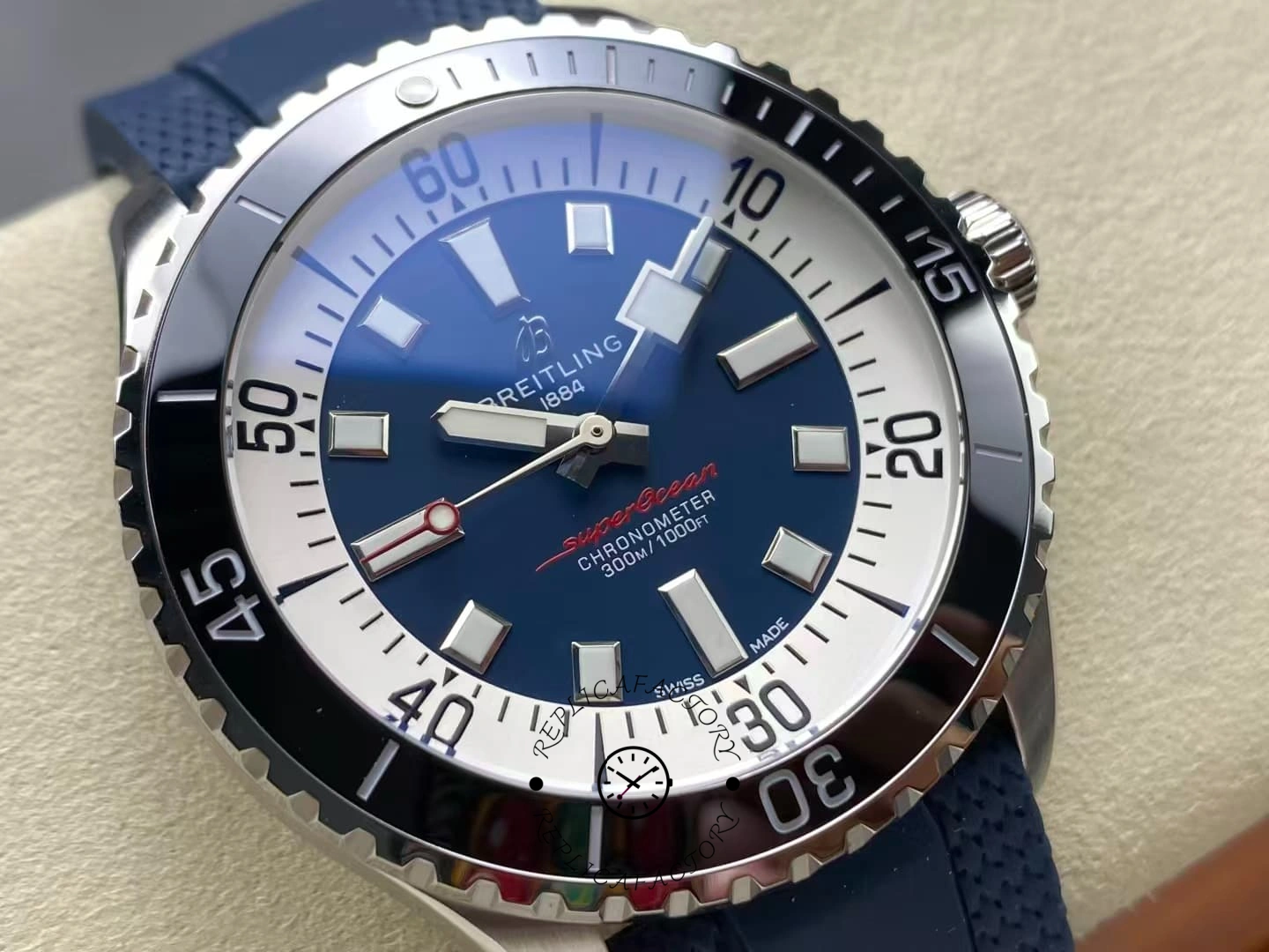 Macro shot of Breitling Superocean A17376211C1S1 blue dial diving watch, red seconds hand.