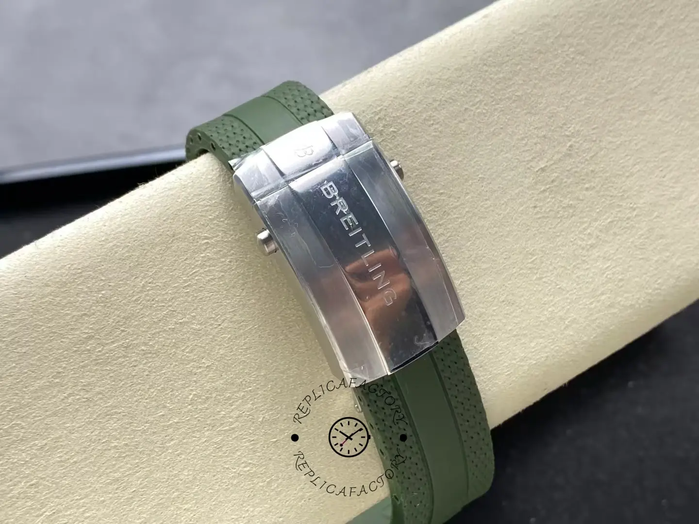 Clasp view of Breitling Superocean A17376A31L1S1 with green rubber strap and polished buckle.
