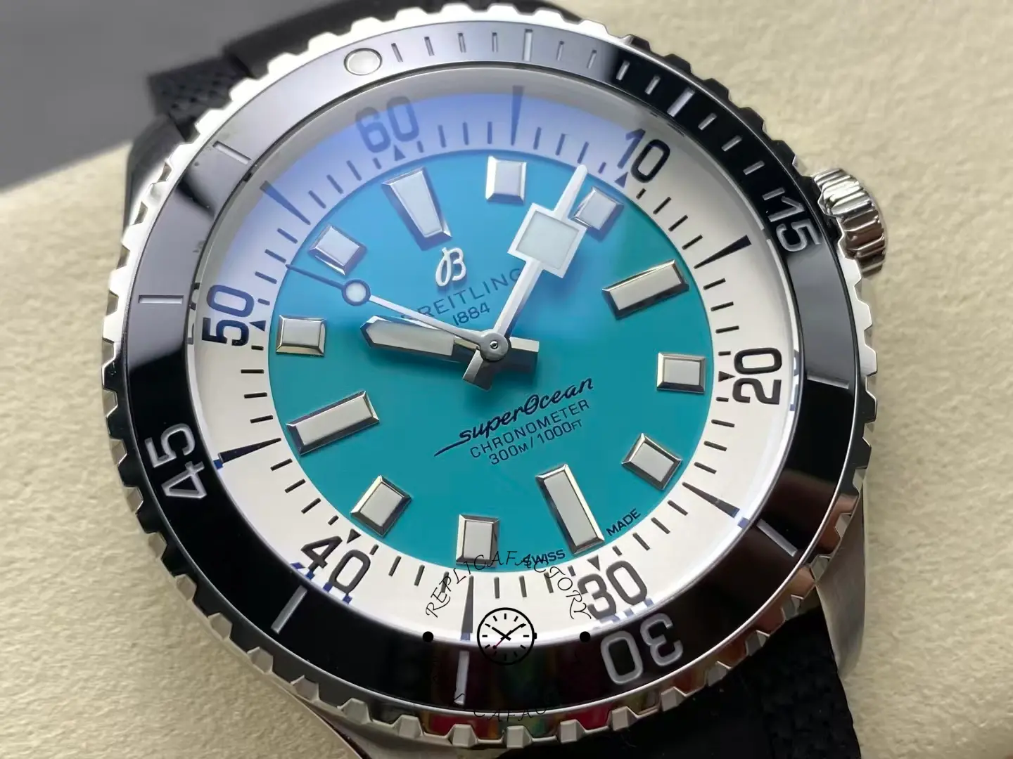 Macro shot of Breitling Superocean 44 A17376211L2S1 showing turquoise dial detail.