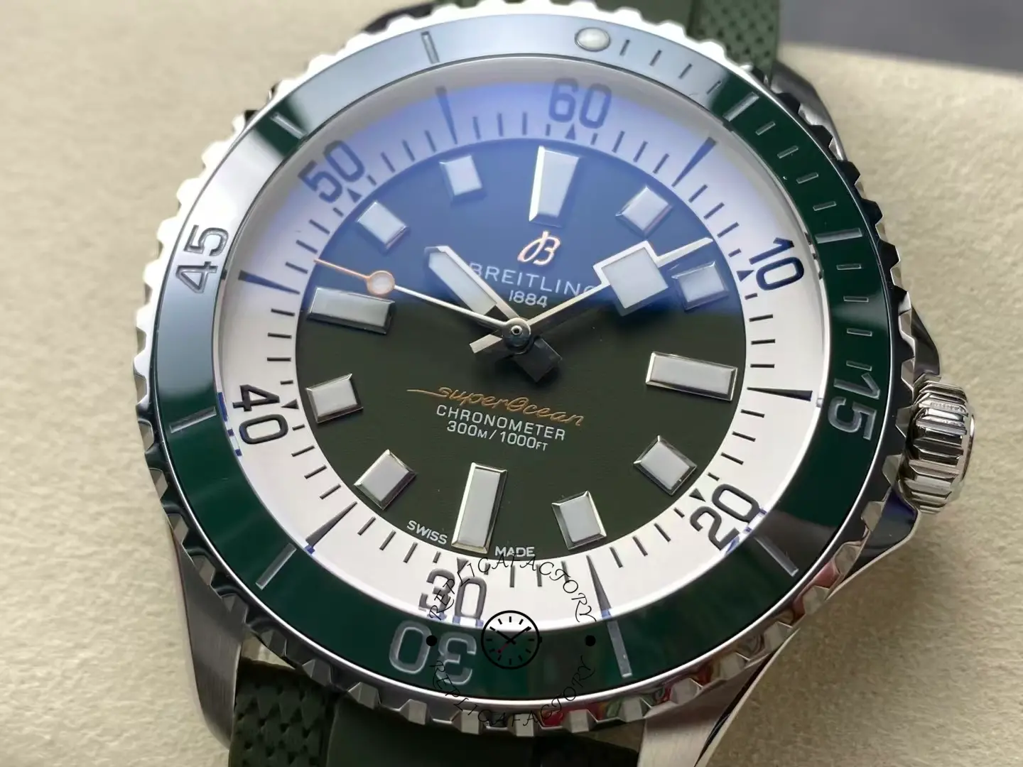 lose-up of Breitling Superocean A17376A31L1S1 green dial and luminous hour markers.