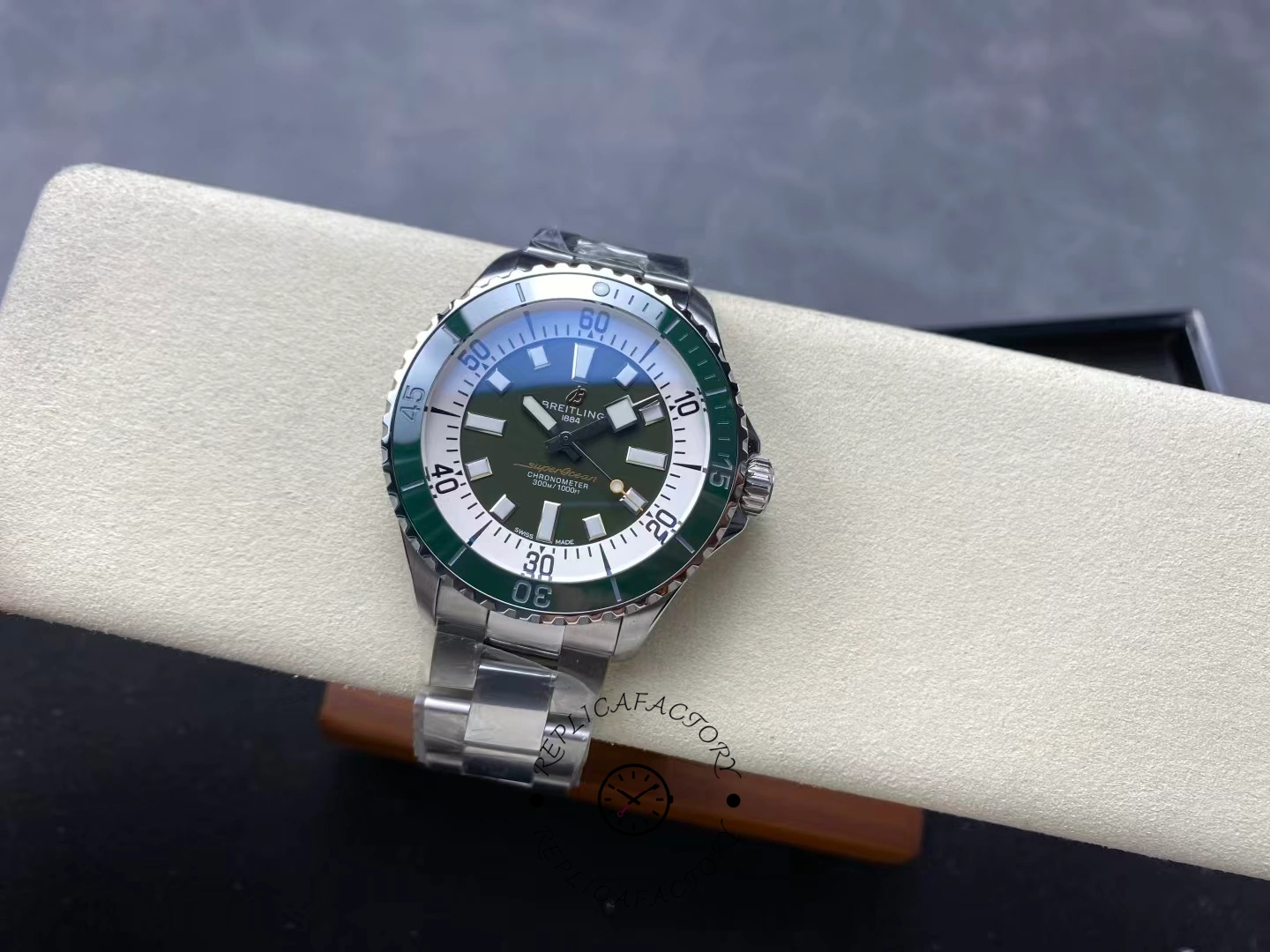 Angled top view of Breitling Superocean 44 A17376A31L1A1 green dial with luminous hands.