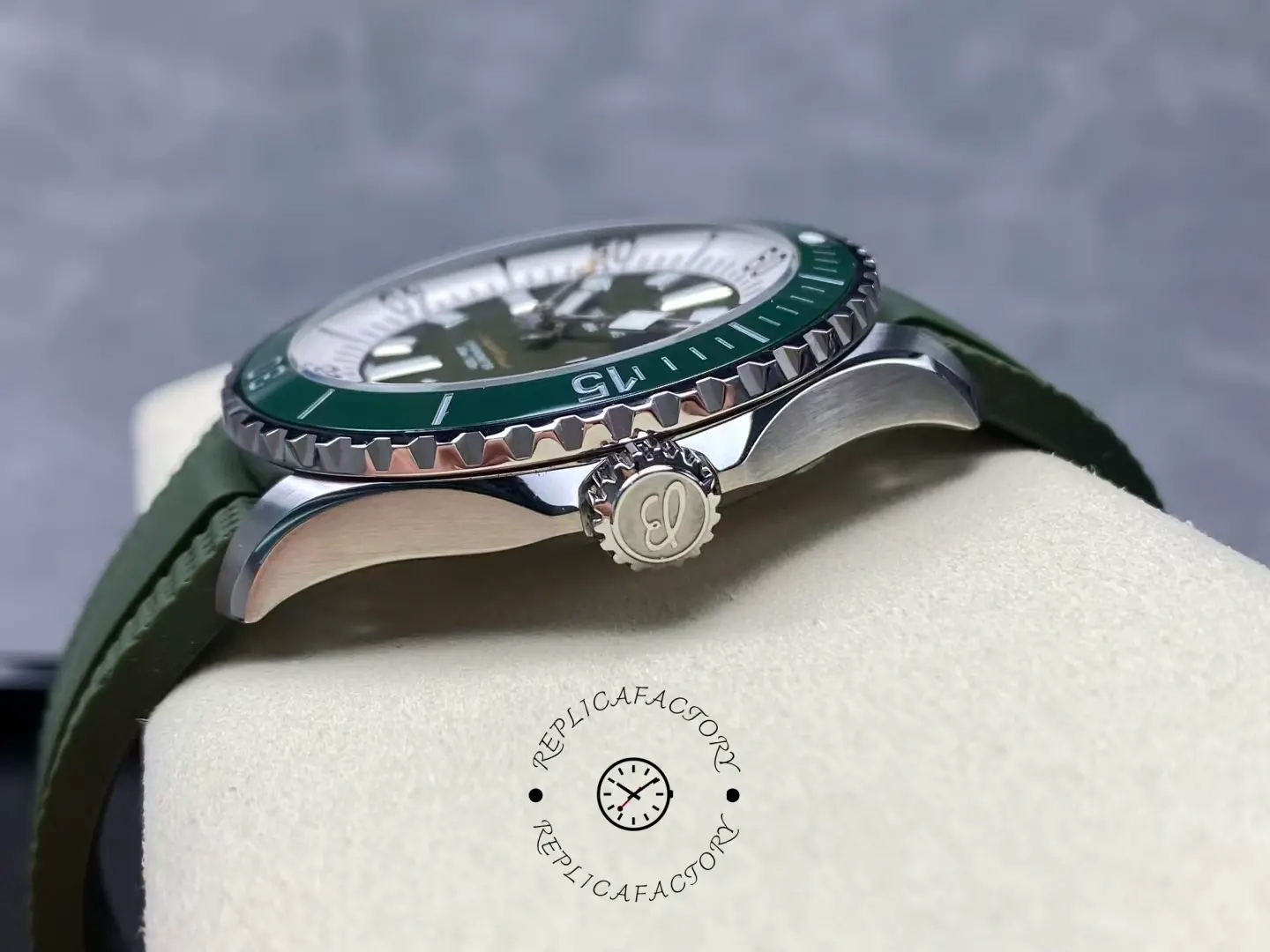 Side profile of Breitling Superocean A17376A31L1S1 showing crown and green ceramic bezel.