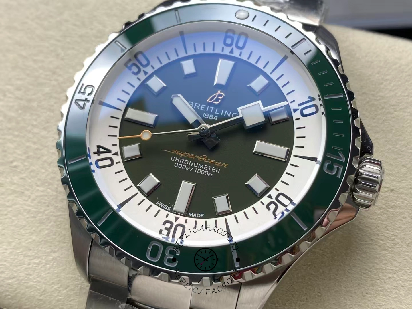 Close-up of Breitling Superocean 44 A17376A31L1A1 green dial and white chapter ring.