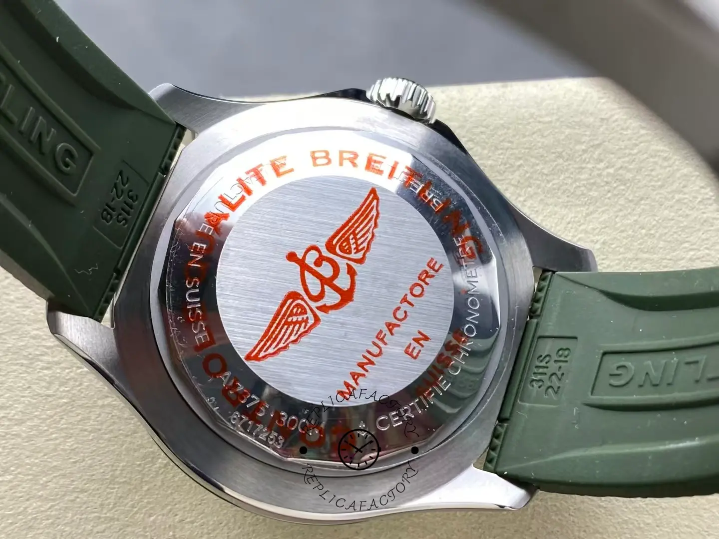 Caseback of Breitling Superocean A17376A31L1S1 showing engraved red logo and specifications.