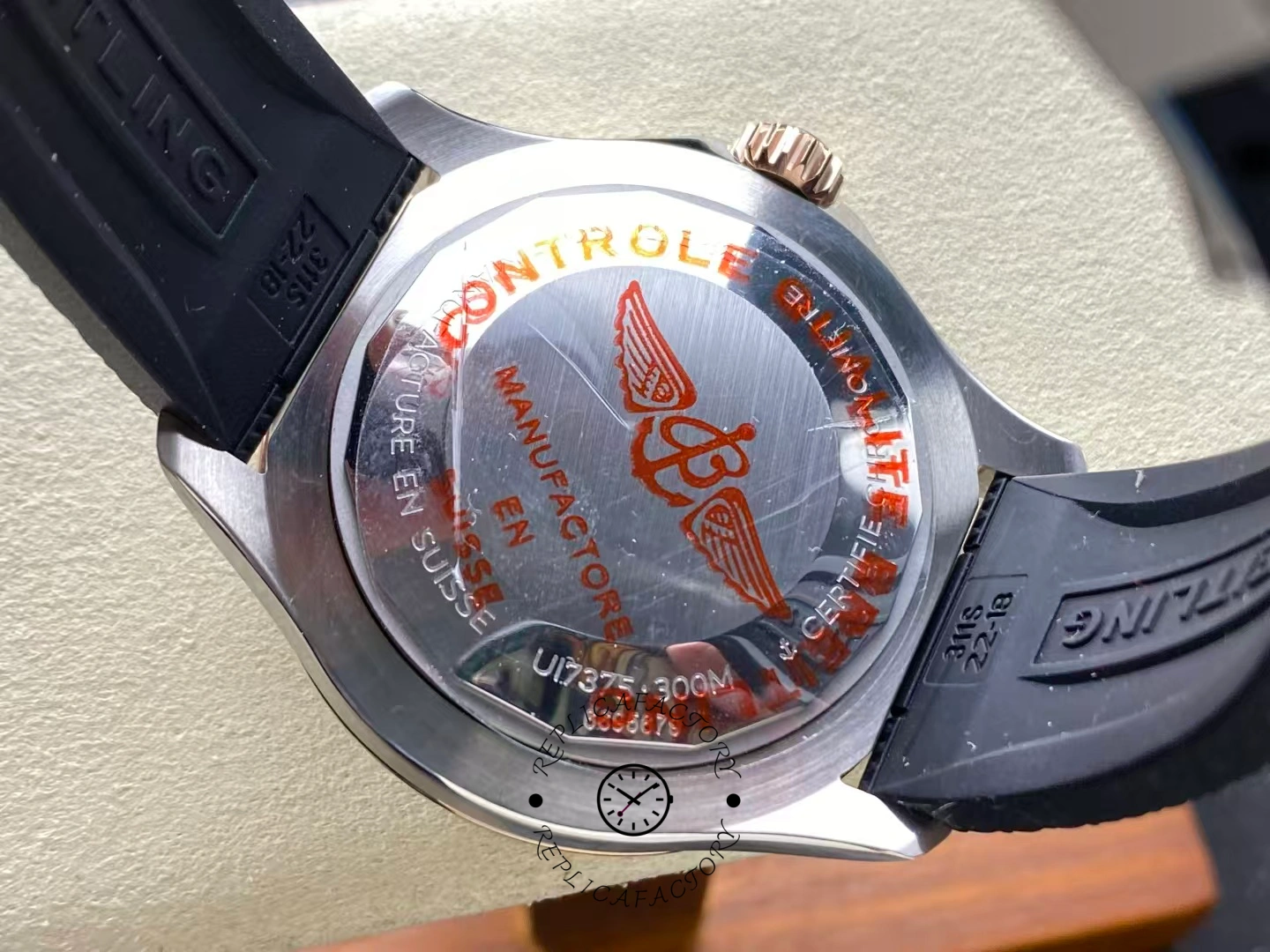 Caseback of Breitling Superocean 42 U17375211B1S1 with red winged Breitling logo.