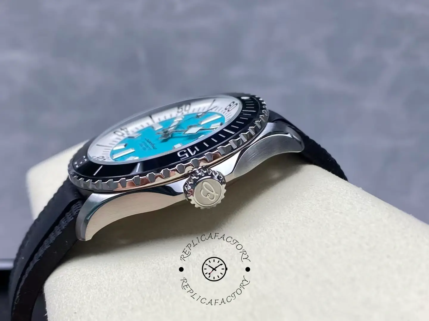 Side view of Breitling Superocean 44 A17376211L2S1 showing signed crown and bezel edge.